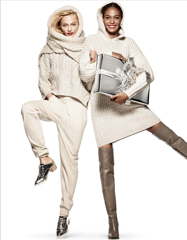 Winter woolies: These two ladies wrap up against the cold in their Christmas knits perfect for the winter weather