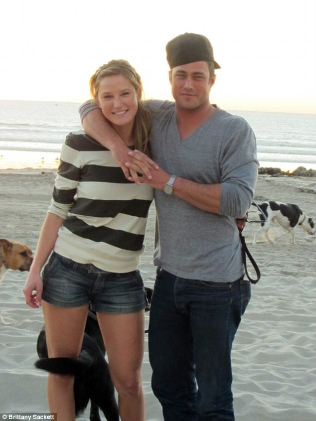 On the beach: Taylor Kinney and Brittany Sackett dated for over a year. 