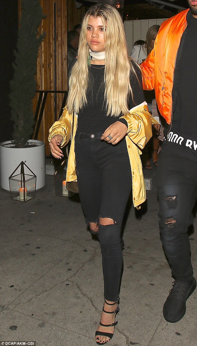 Relaxed style: Sofia Richie dressed down in black and gold for a rendezvous at her favorite LA hotspot The Nice Guy in West Hollywood on Thursday night