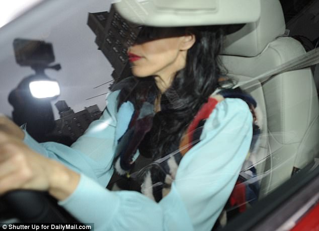 Avoiding public transit: Huma  was pictured behind the wheel of her car as she returned to her New York City on Monday morning, presumably after dropping Jordan off at school